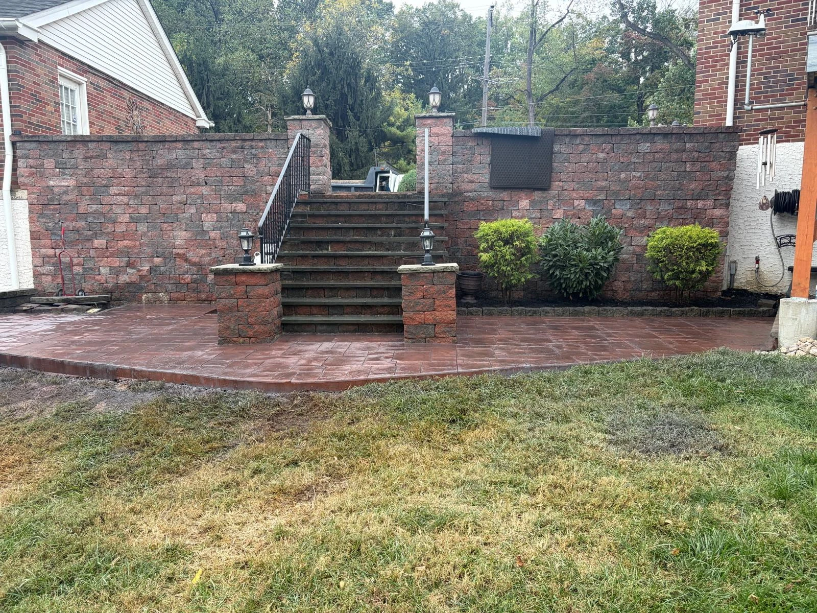 Brick terrace and walls framing a wide outdoor staircase